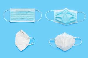 KN95 and surgical face mask on blue background protection against pm 2.5 polution and COVID-19 coronavirus. Healthcare and medical concept photo