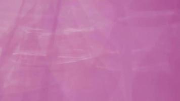 sombra de lâmpada movendo-se na parede de cor rosa para o conceito abstrato e de fundo. video