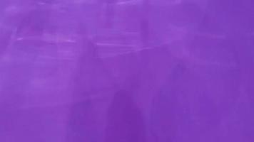 Light bulb shadow moving on purple color wall for abstract and background concept. video