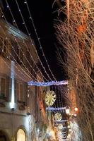 electric christmas garlands in town at night photo