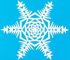 white snowflake on blue paper photo