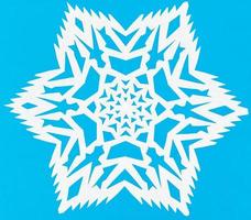 white snowflake on blue paper photo