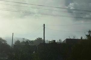 The apartment building is in front of a thick layer of fog. Living in a mountainous area in the Carpathians, Ukraine photo