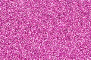 Pink decorative sequins. Background image with shiny bokeh lights from small elements photo
