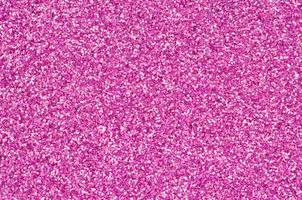 Pink decorative sequins. Background image with shiny bokeh lights from small elements photo