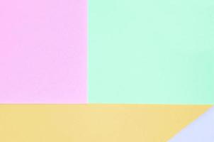 Texture background of fashion pastel colors. Pink, violet, orange and blue geometric pattern papers. photo