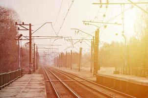 A railway station with platforms for waiting for trains photo