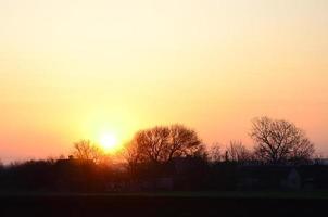 Dawn in the village. Sunrise in the suburban landscape photo