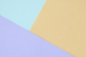 Texture background of fashion pastel colors. Violet, orange, and blue geometric pattern papers. photo