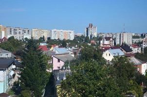 Roofs of modern houses under a cloudless sky. Metal roofing method photo