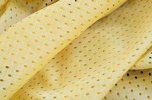 Yellow mesh sport wear fabric textile background pattern photo