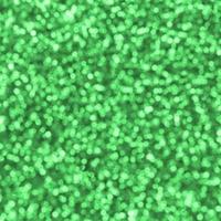 Blurred green decorative sequins. Background image with shiny bokeh lights from small elements photo