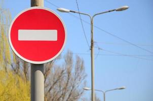 Road sign in the form of a white rectangle in a red circle. No entry photo