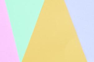 Texture background of fashion pastel colors. Pink, violet, orange and blue geometric pattern papers. photo