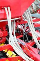 Springs and tubes are arranged in a row. A row of seeder. Heavy equipment on agricultural exhibition photo