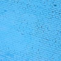 Square brick block wall background and texture. Painted in blue photo