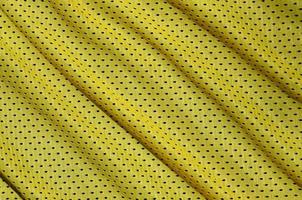 Texture of sportswear made of polyester fiber. Outerwear for sports training has a mesh texture of stretchable nylon fabric photo