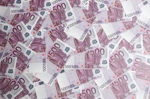 Close up background photo Amount of Five hundred notes of European Union Currency. Many pink 500 euro banknotes are adjacent. Symbolic texture photo for wealth