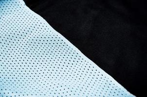 Close up of light blue polyester nylon sportswear shorts to created a textured background photo