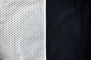 Sport clothing fabric texture background. Top view of white polyester nylon cloth textile surface. Colored basketball shirt with free space for text photo