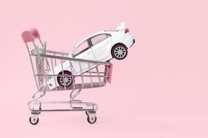 Car buying and leasing concept. Vehicle in shopping cart photo