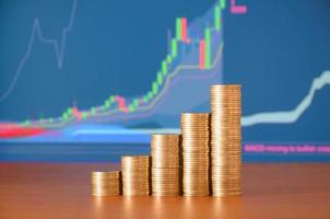 Golden coin stacks arranged as a graph. Increasing columns of coins photo