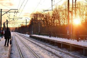 Evening winter landscape with the railway station photo