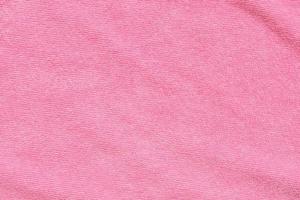 Pink towel fabric texture surface close up background photo