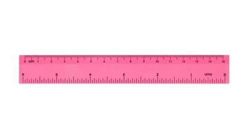 Pink plastic ruler isolated on white background photo