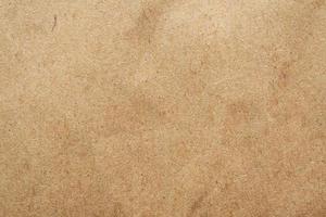 Brown eco recycled kraft paper sheet texture cardboard background photo