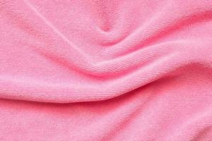 Pink towel fabric texture surface close up background photo