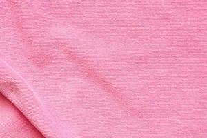 Pink towel fabric texture surface close up background photo