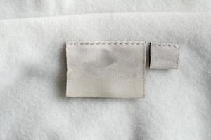 laundry care clothing label on fabric texture photo