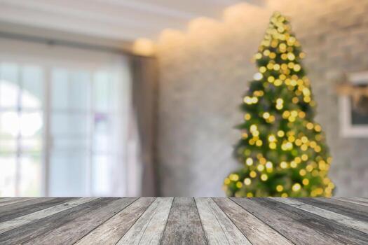 Empty table top with blurred Christmas tree with bokeh light background photo