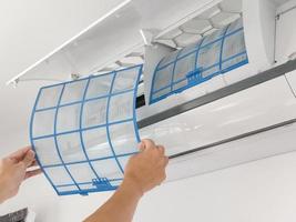 man hand hold air conditioner filter cleaning concept photo