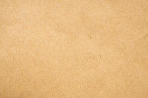 Brown eco recycled kraft paper sheet texture cardboard background photo