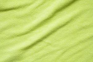 superficie de textura de tela de toalla verde cerrar fondo foto