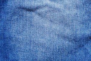 Denim blue jeans texture close up background top view photo