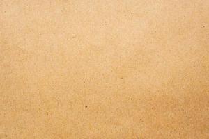 Brown eco recycled kraft paper sheet texture cardboard background photo