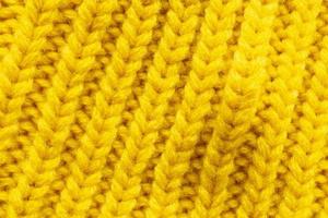 Yellow knitting wool texture background photo