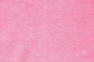 Pink towel fabric texture surface close up background photo