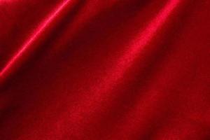 Red fabric cloth texture background close up photo