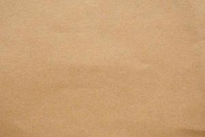 Brown paper eco recycled kraft sheet texture cardboard background photo