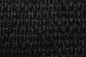 Black sports clothing fabric football shirt jersey texture close up photo