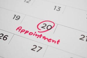 important appointment schedule write on white calendar page date close up photo