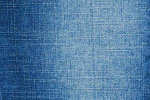 Denim blue jeans texture close up background top view photo