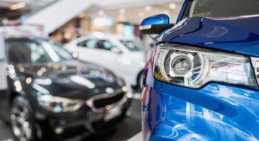 new cars in dealer showroom interior background photo