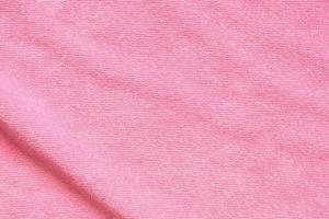 Pink towel fabric texture surface close up background photo