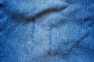 Denim blue jeans torn fashion design texture close up background top view photo