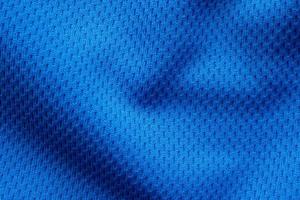 Blue sports clothing fabric football shirt jersey texture close up photo